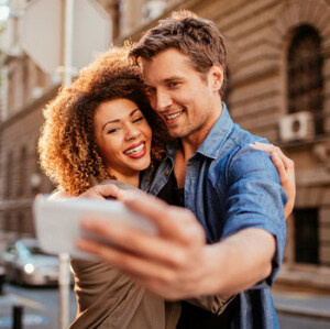 man and woman taking a selfie