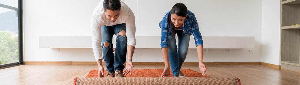 couple rolling carpet