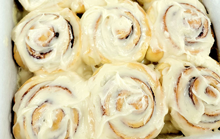 Baked Cinnamon rolls sold by Elm Tree Cottage Bakery.