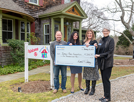 Members of Tommy's Place posing with their giant five thousand dollar check from Rockland Trust's Charitable Foundation.