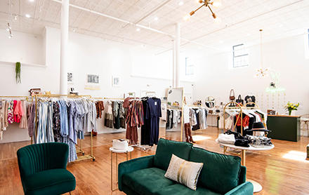 Women's clothing and accessories on display at Sprezzatura Boutique.